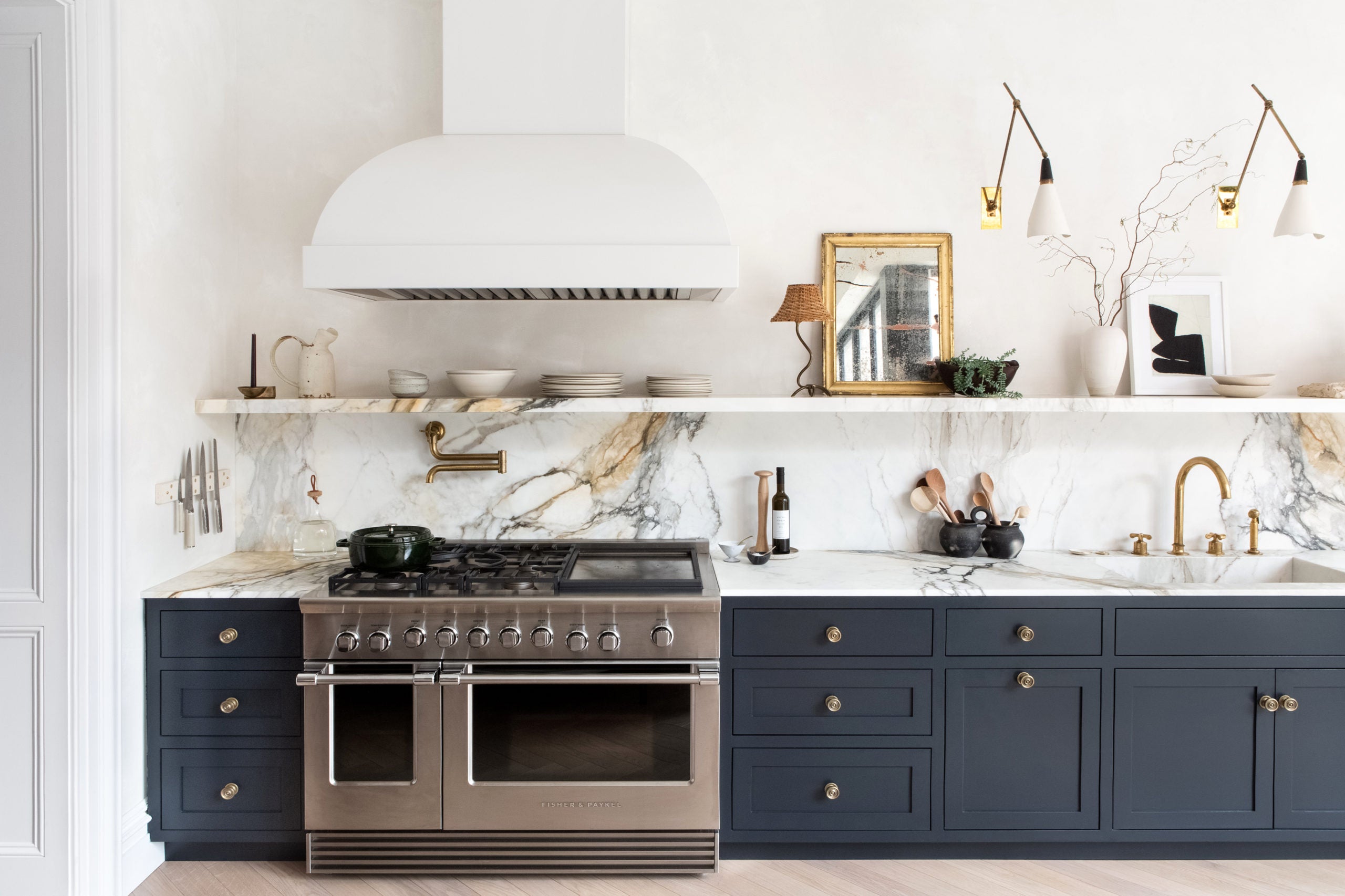Detailed view of a thick marble shelf showing the seamless connection to the kitchen wall.