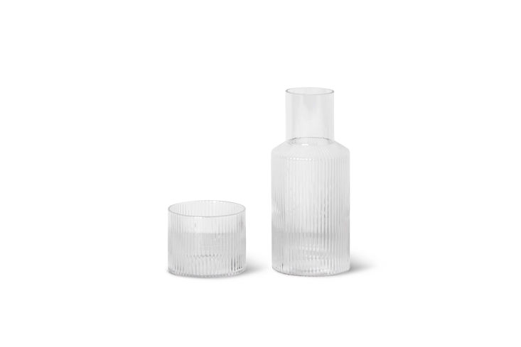 Clear glass carafe and glass set with a vertical ripple texture.