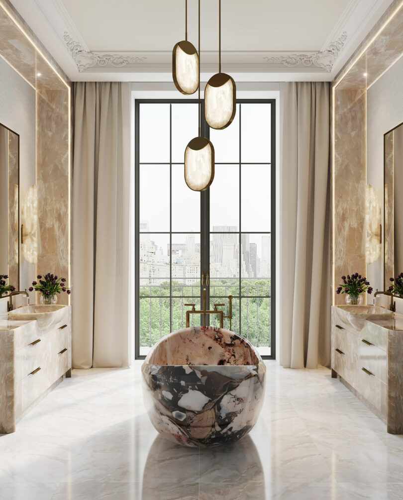 A large, luxury marble bathtub positioned as a focal point under modern pendant lighting.