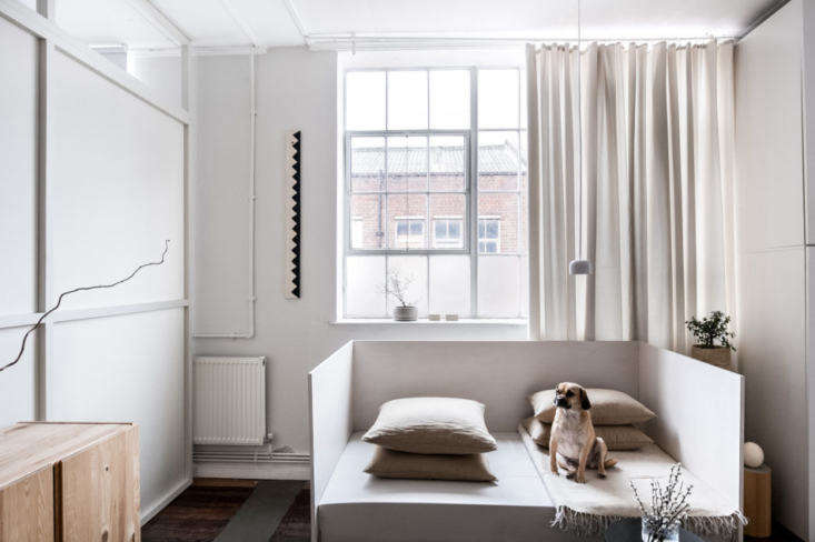 A DIY daybed made from birch plywood in a north London loft.