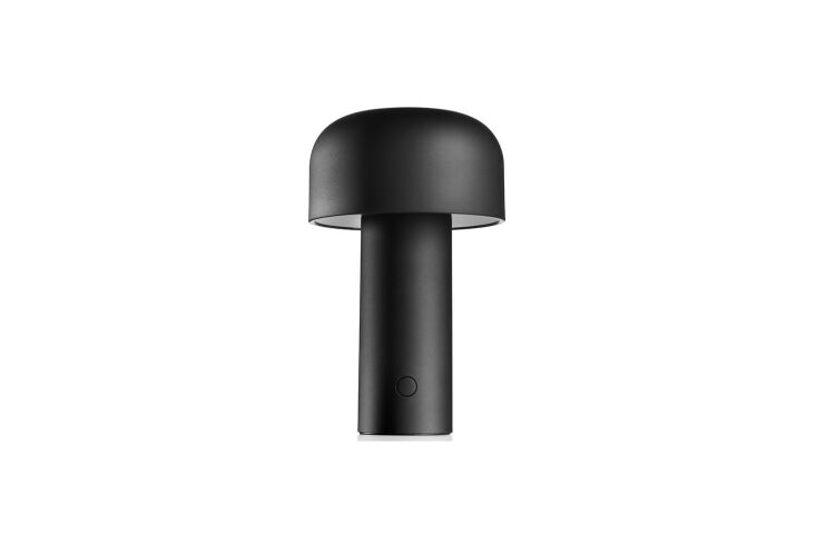A sleek, mushroom-shaped Flos Bellhop rechargeable lamp.