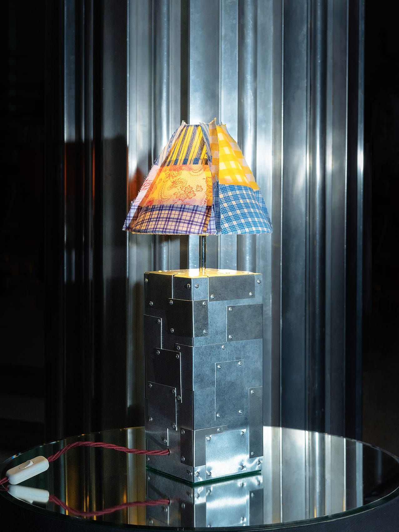 Interior view of an artisan table lamp showing the metal framework and the light-filtering quality of the linen.