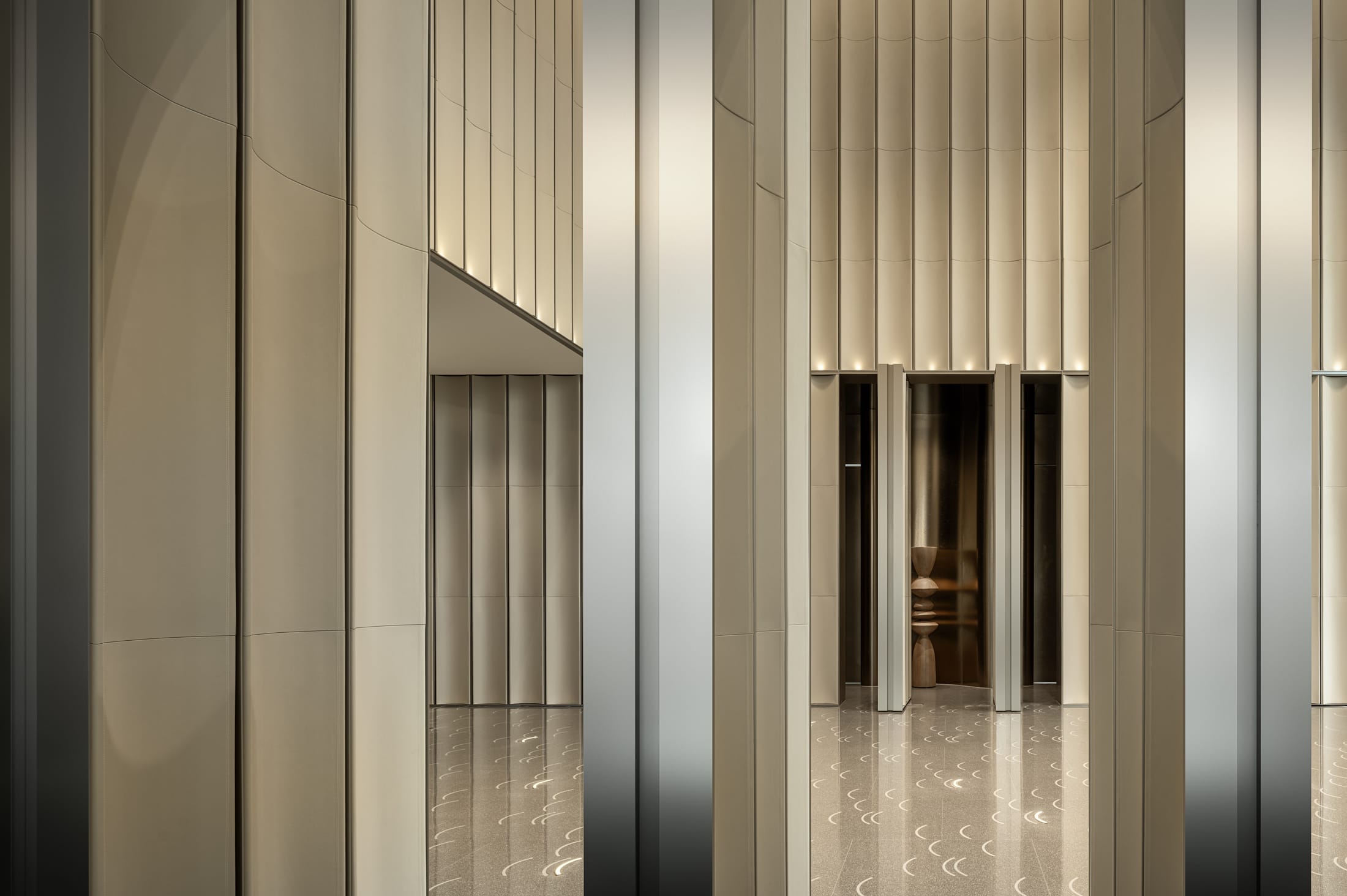 A bright, modern seating area looking toward the suspended capsule, capturing the essence of activity-based working.
