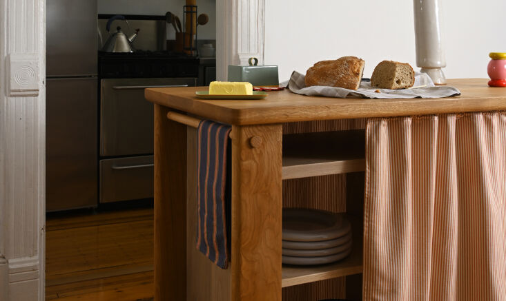 Solid white oak Hearth Island with fabric curtains and a butcher-block top.