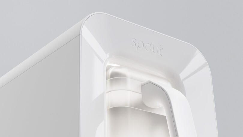 A minimalist close-up of the white Spout water dispenser against a neutral background.