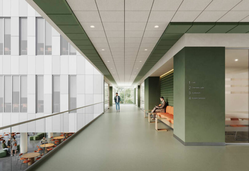 Modern hallway with green acoustic wall accents and a directory sign.