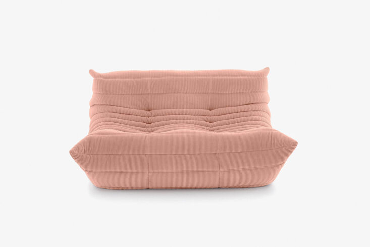 A vintage-style Togo Loveseat in corduroy fabric.