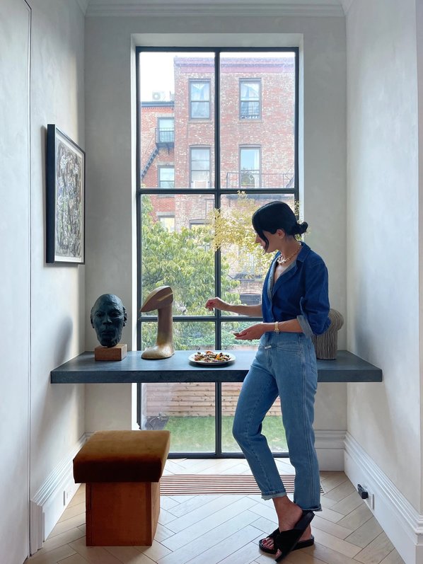 Golden brown roasted squash slices spread out on a metal baking sheet.