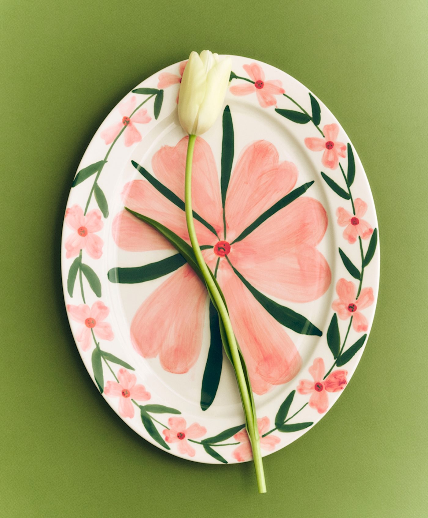 The Josephine platter with a green plant illustration on a white ceramic background.