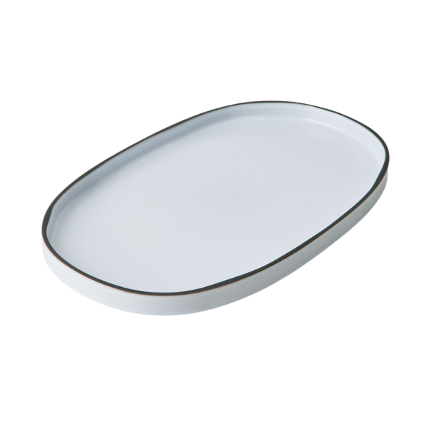 Whole and halved raw delicata squash showing its characteristic green and cream-colored stripes.