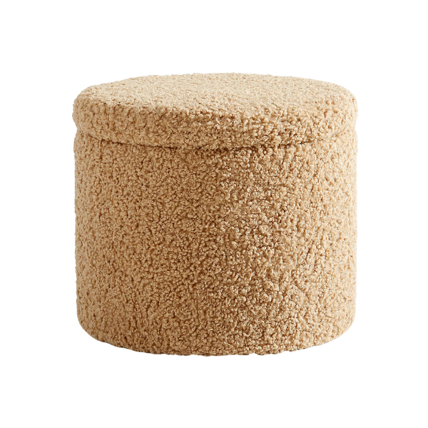 A textured bouclé storage ottoman in a nursery setting.