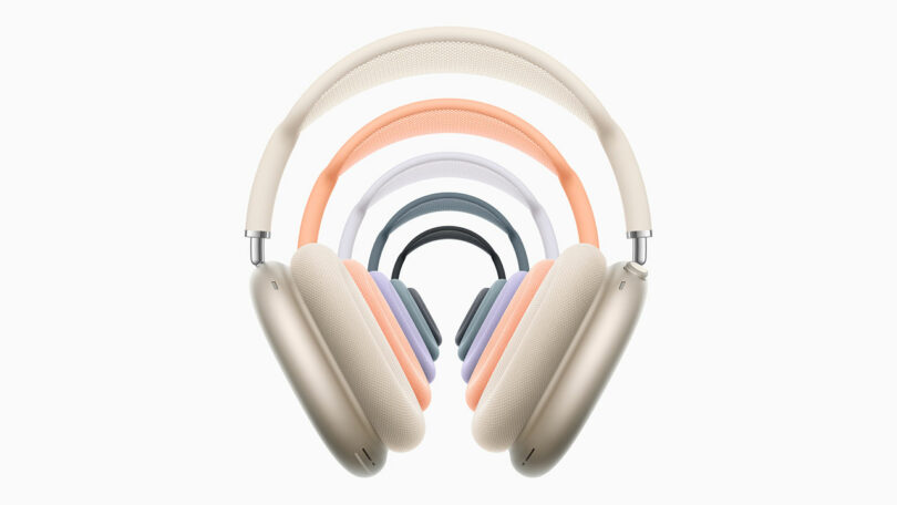 A lineup of five AirPods Max 2 headphones in beige, orange, purple, blue, and green.