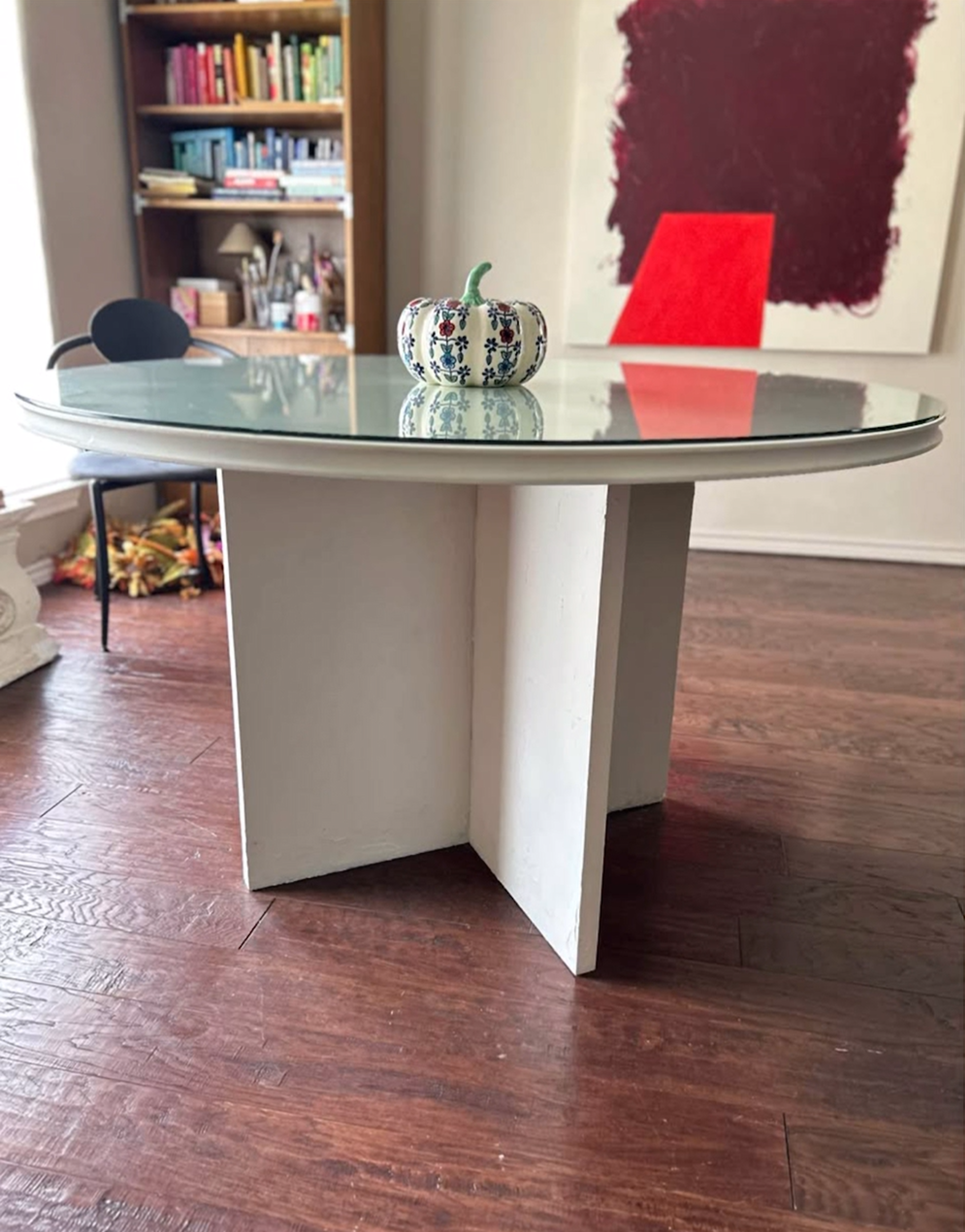 A worn, scratched vintage wooden dining table before restoration.