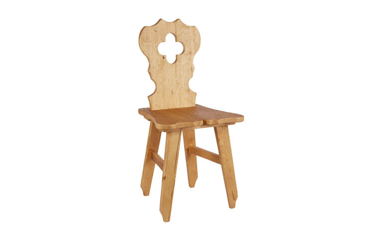 A rustic Tyrolean style chair made from reclaimed pine wood.