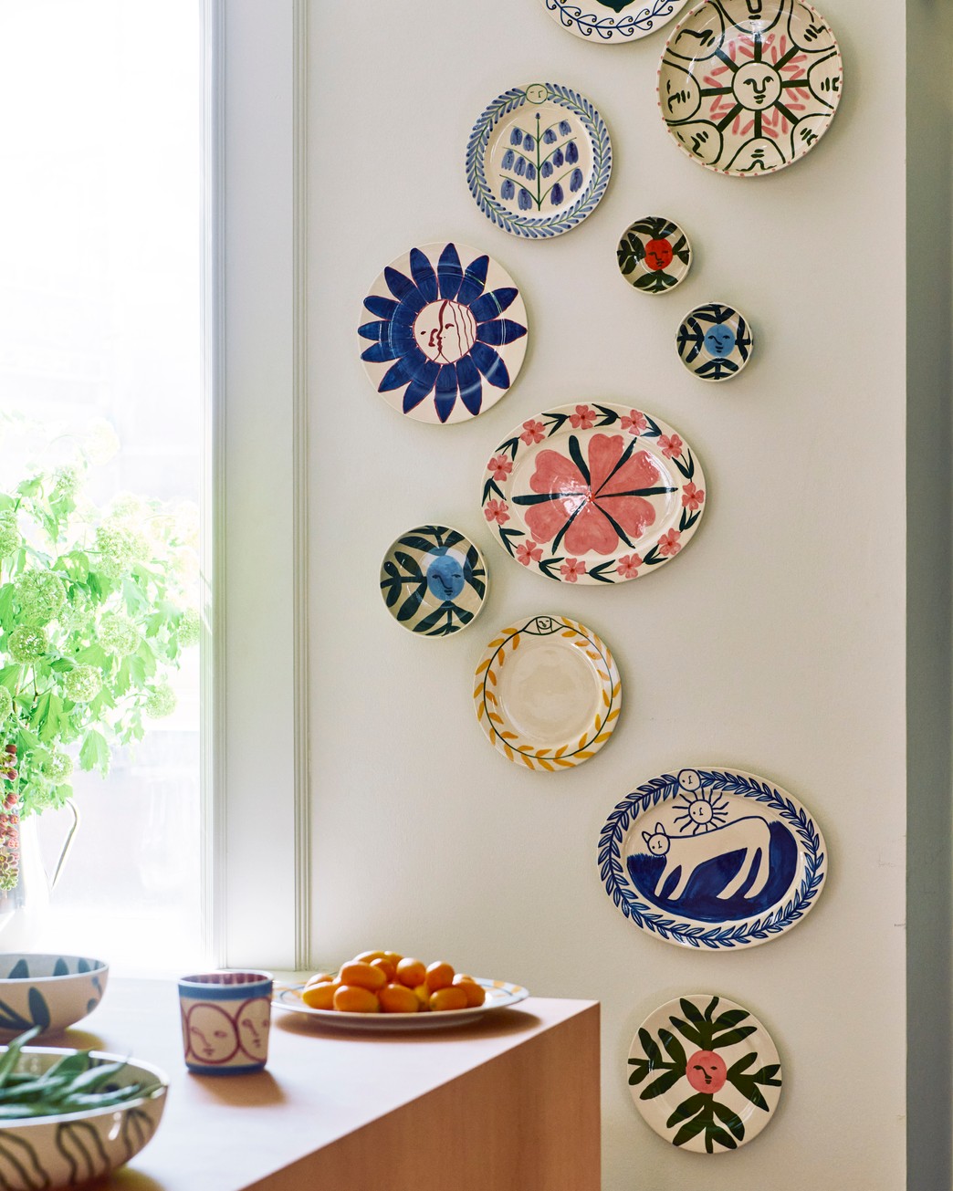 The Charlotte cat platter displayed alongside other vessels at Hay House.