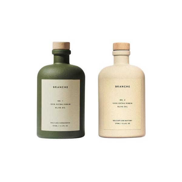 A silver fork flaking a piece of cooked cod to show its moist, layered texture.