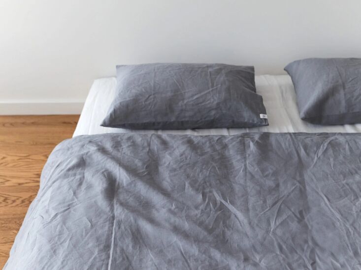 Folded linen components in a neutral 'Stone' gray color.