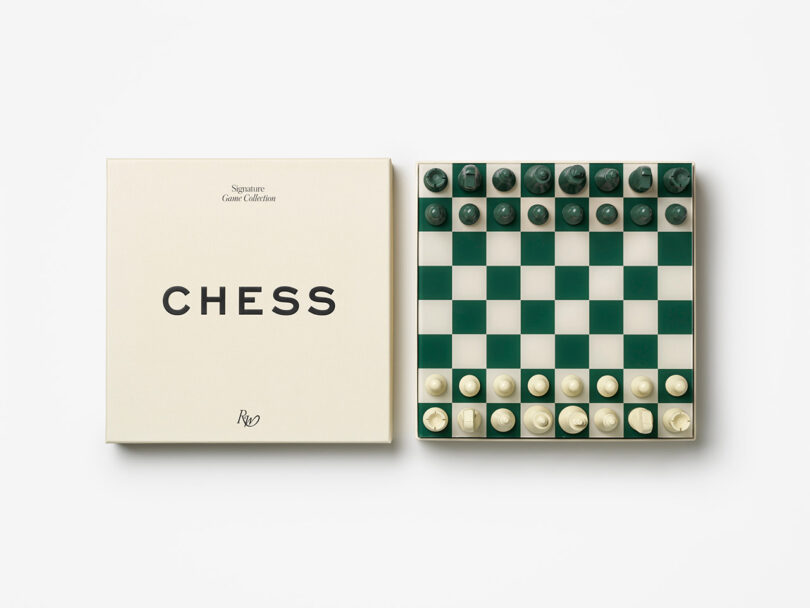 A green and white chessboard set up next to its designer cream box labeled CHESS.