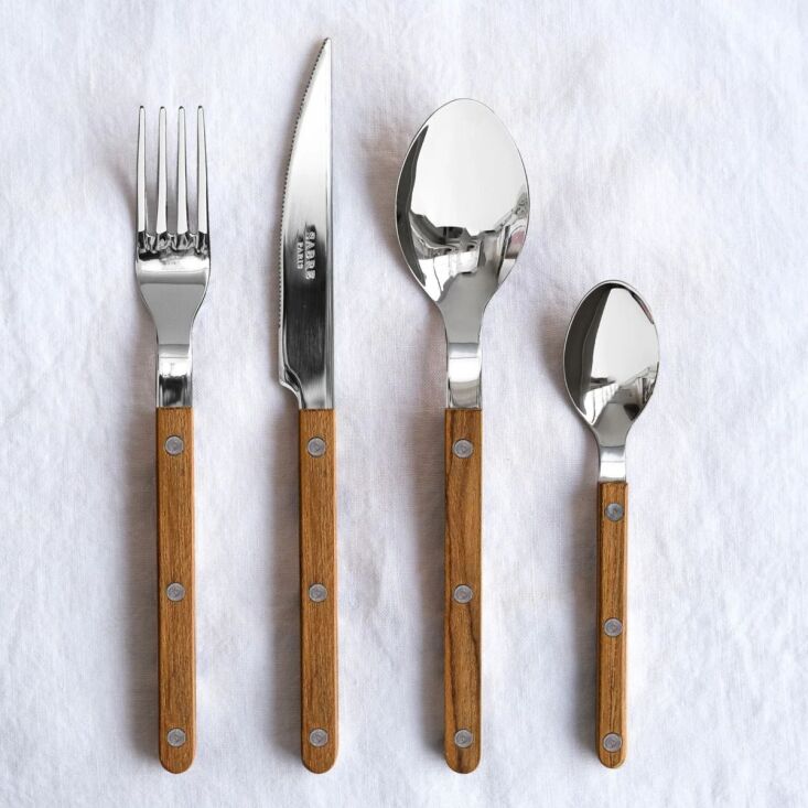 Sabre Bistrot flatware featuring natural teak wood handles.