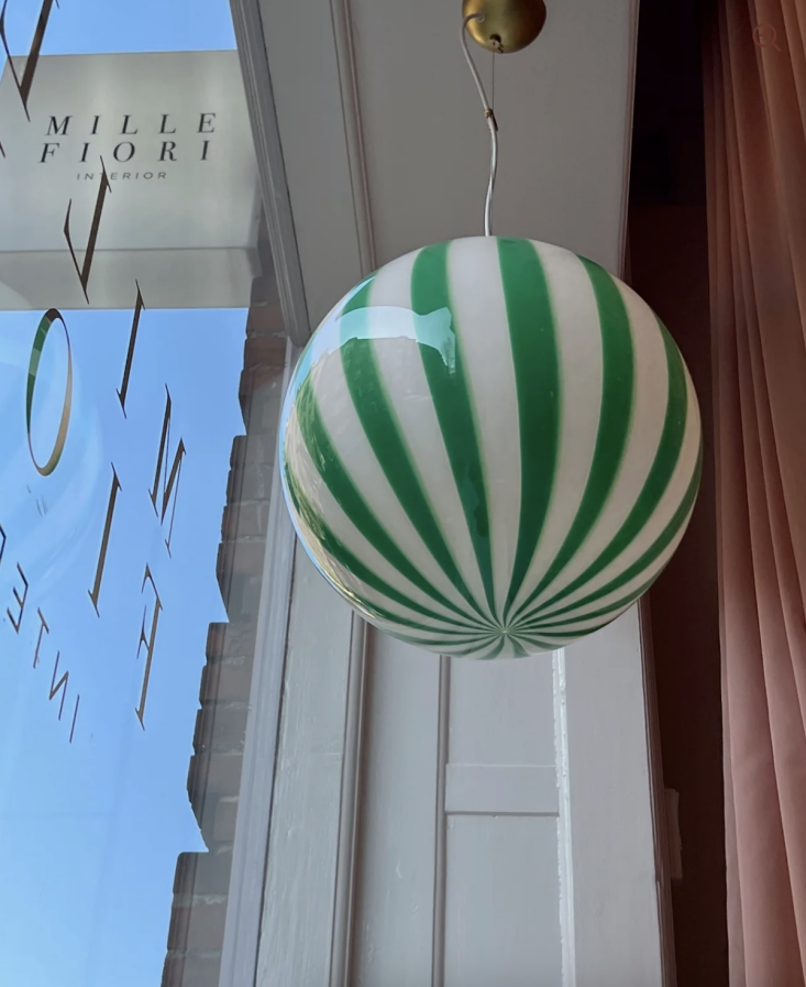 A green and white striped Murano glass hanging lamp.