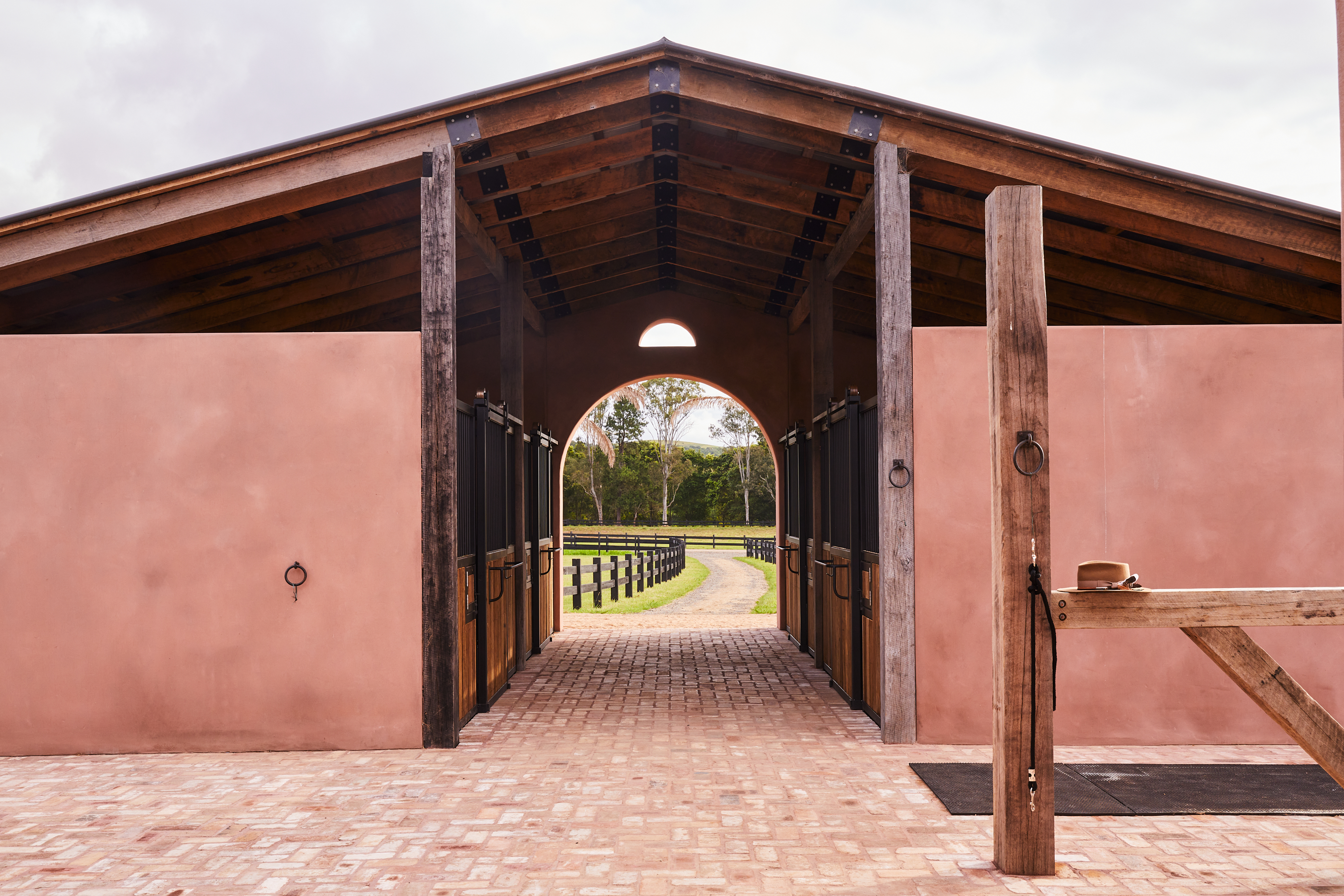 Architectural view of the horse stables at Copperstone Estate featuring high-end joinery and scenic views.