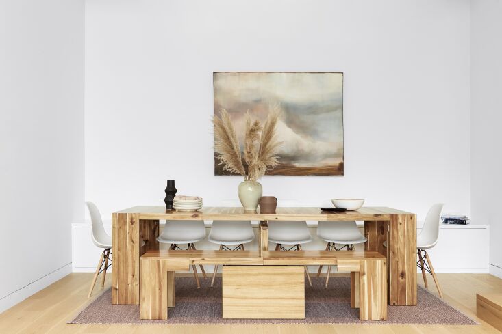 A fully extended 10-foot Transformer Table set for a dinner party with ten chairs.