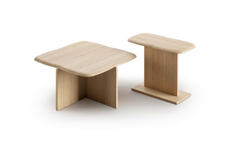 Minimalist solid oak side tables with intersecting panel bases, representing sustainable furniture design.