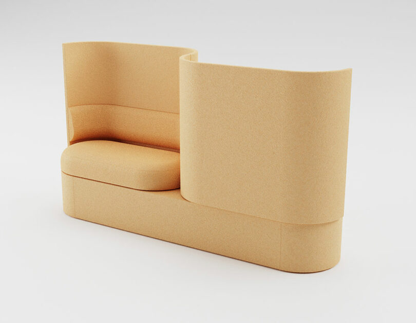 A beige modular sofa with a high, curved backrest providing visual and acoustic privacy.