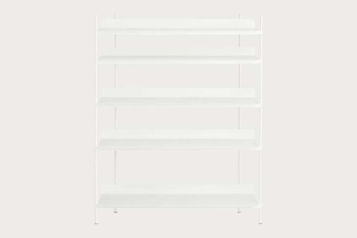 A white Muuto Compile Shelving System with five shelves in a minimalist room.