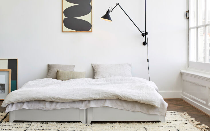 Minimalist Toro Bed made of gray anodized aluminum stacked on top of another frame.