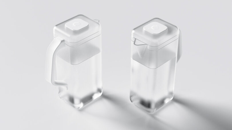 Two clear square water pitchers with lids and spouts, part of the Spout filtration system.