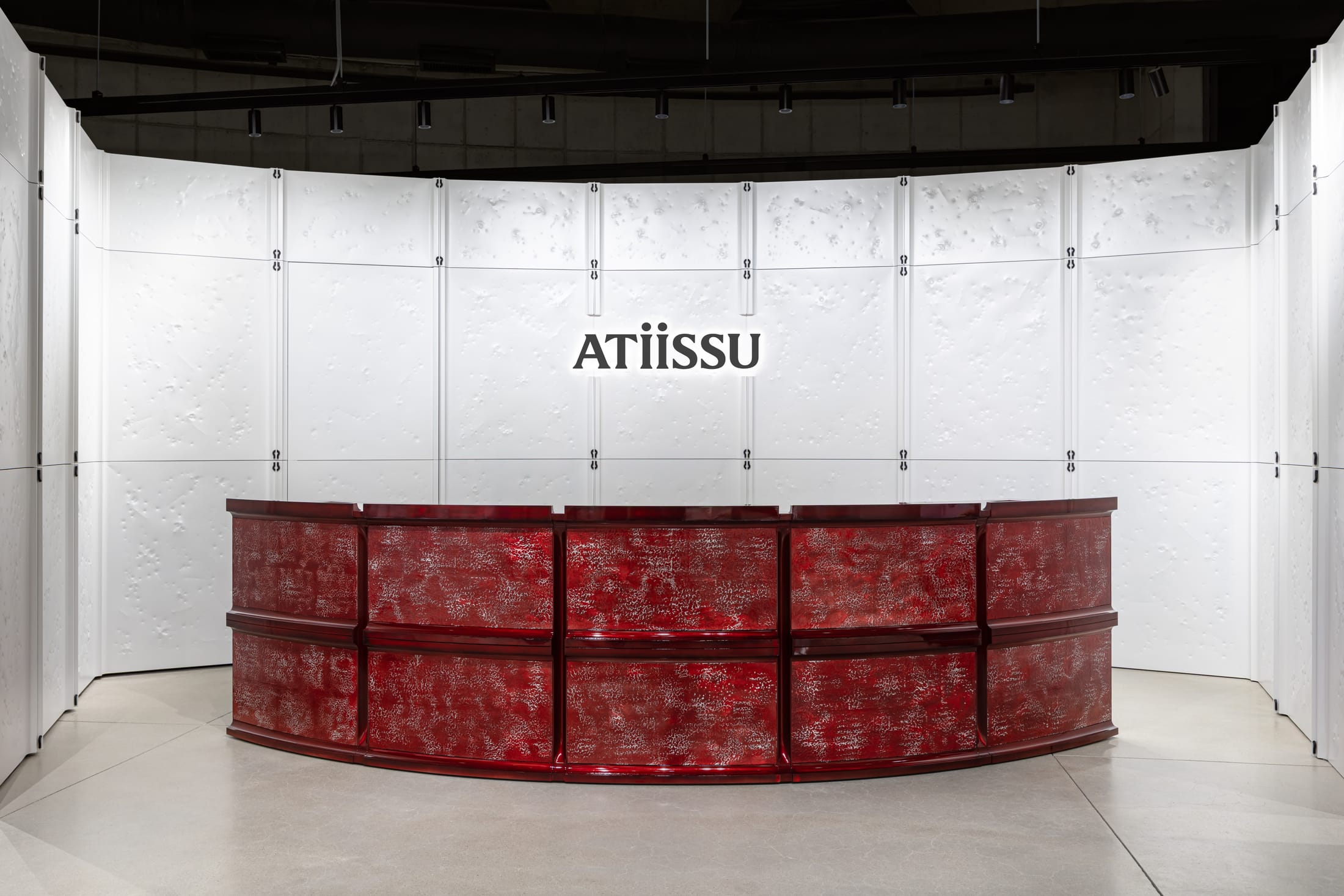 Display of Atiissu beanies and headwear with unique metal studs and horn designs.