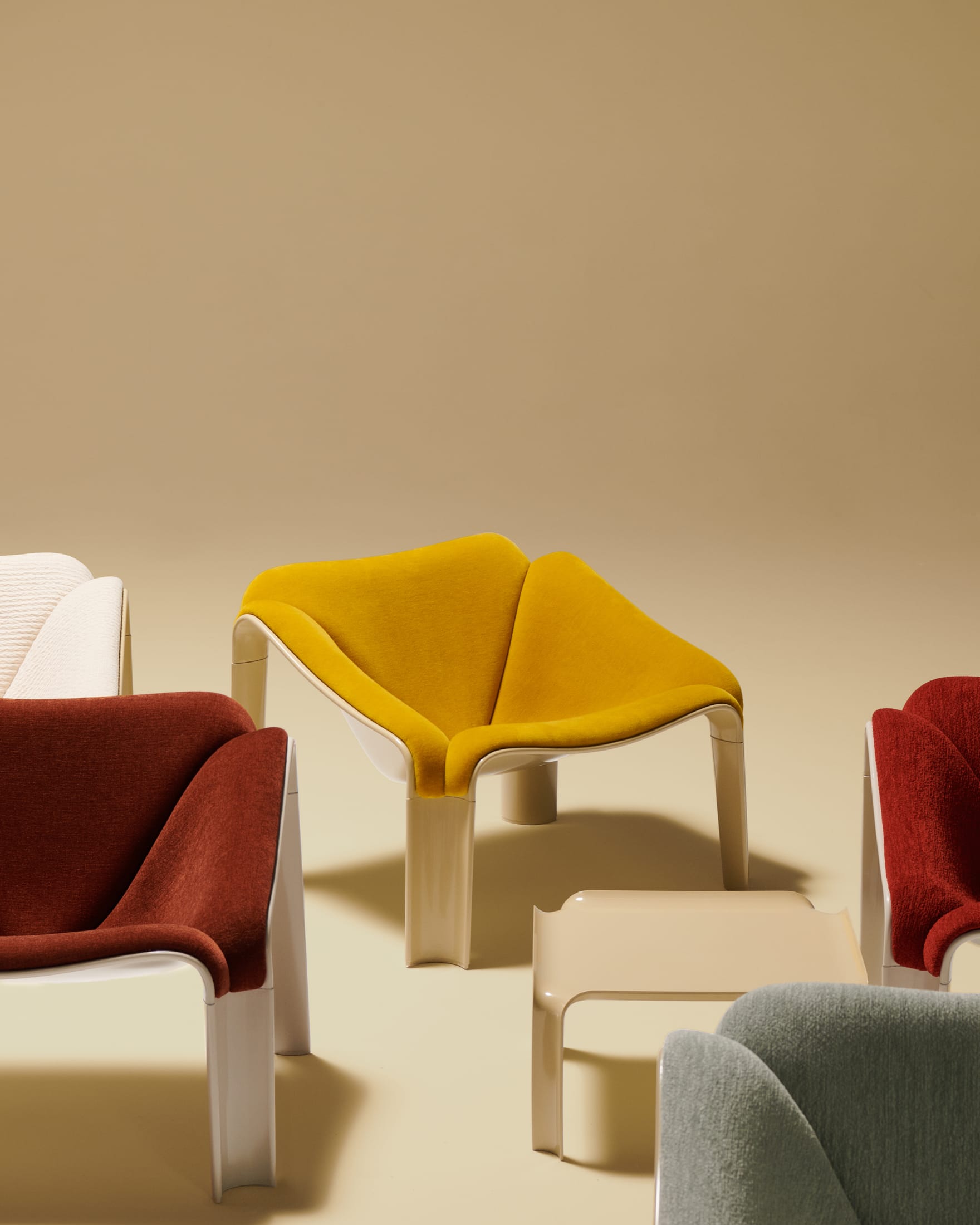 A green F300 chair paired with a white T877 side table in a modern interior.