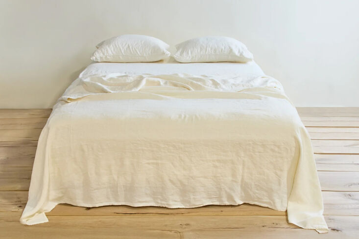 Saturated colored linen sheets with a soft, textured finish.