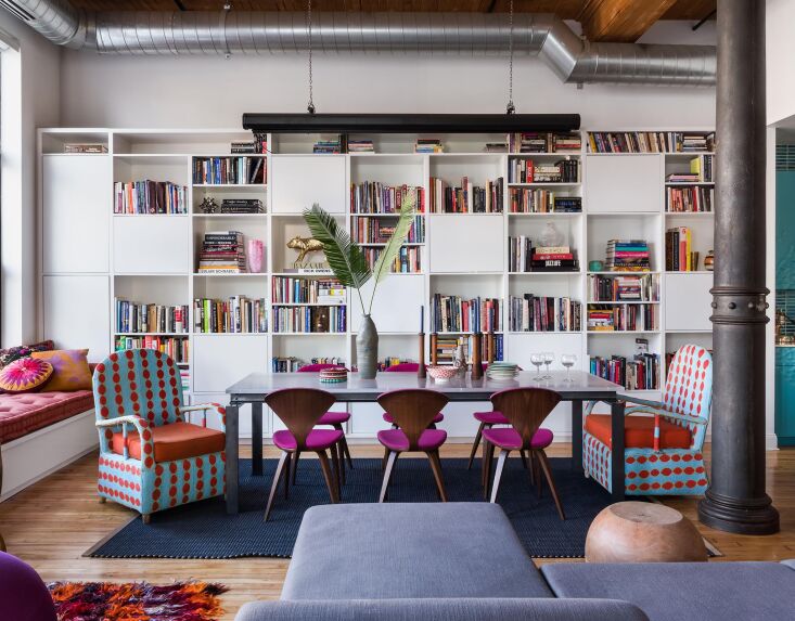 Two blue and white two-toned beaded armchairs placed in a contemporary Brooklyn loft.