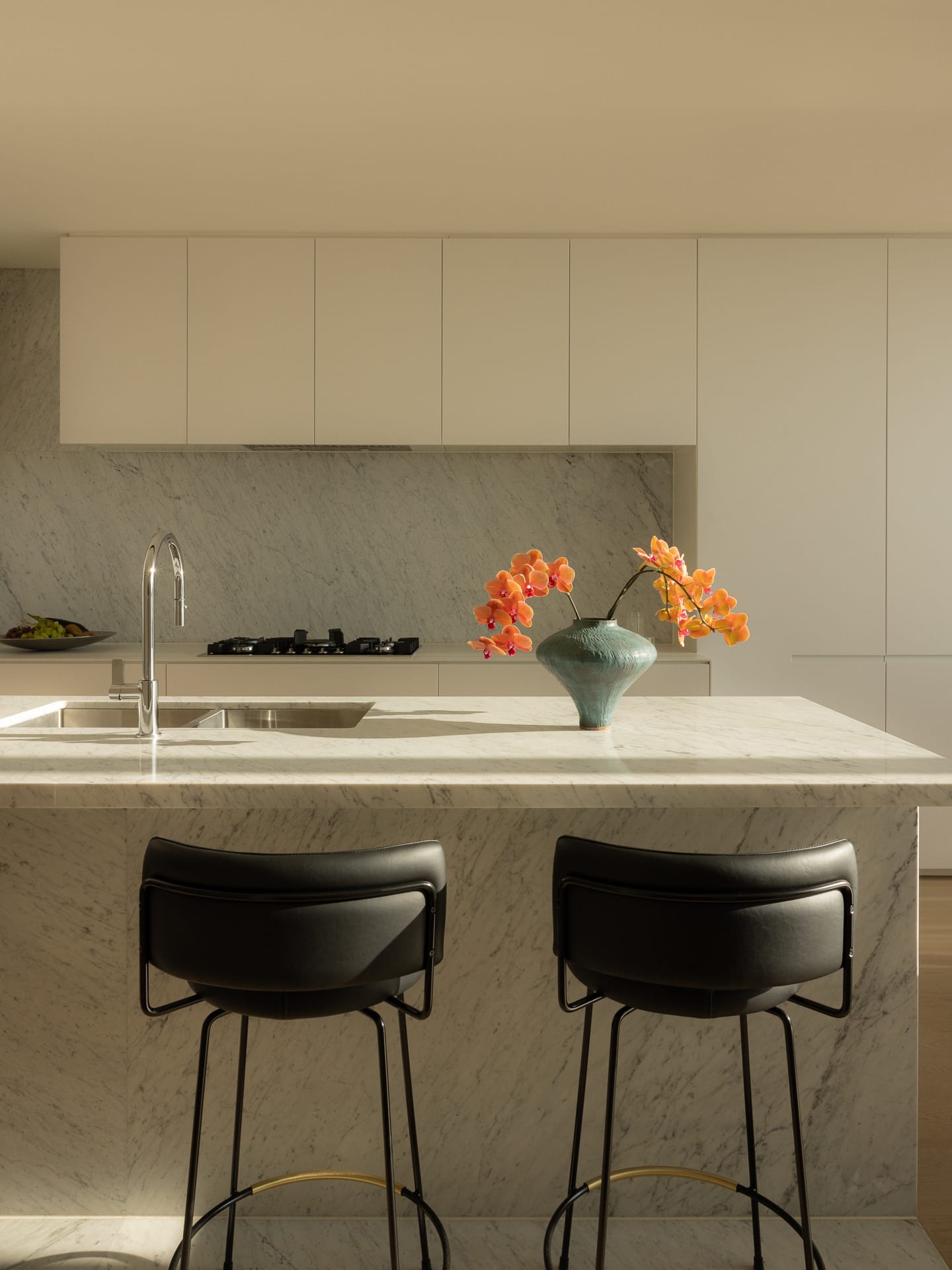 A serene master bedroom with minimalist styling and soft natural lighting.