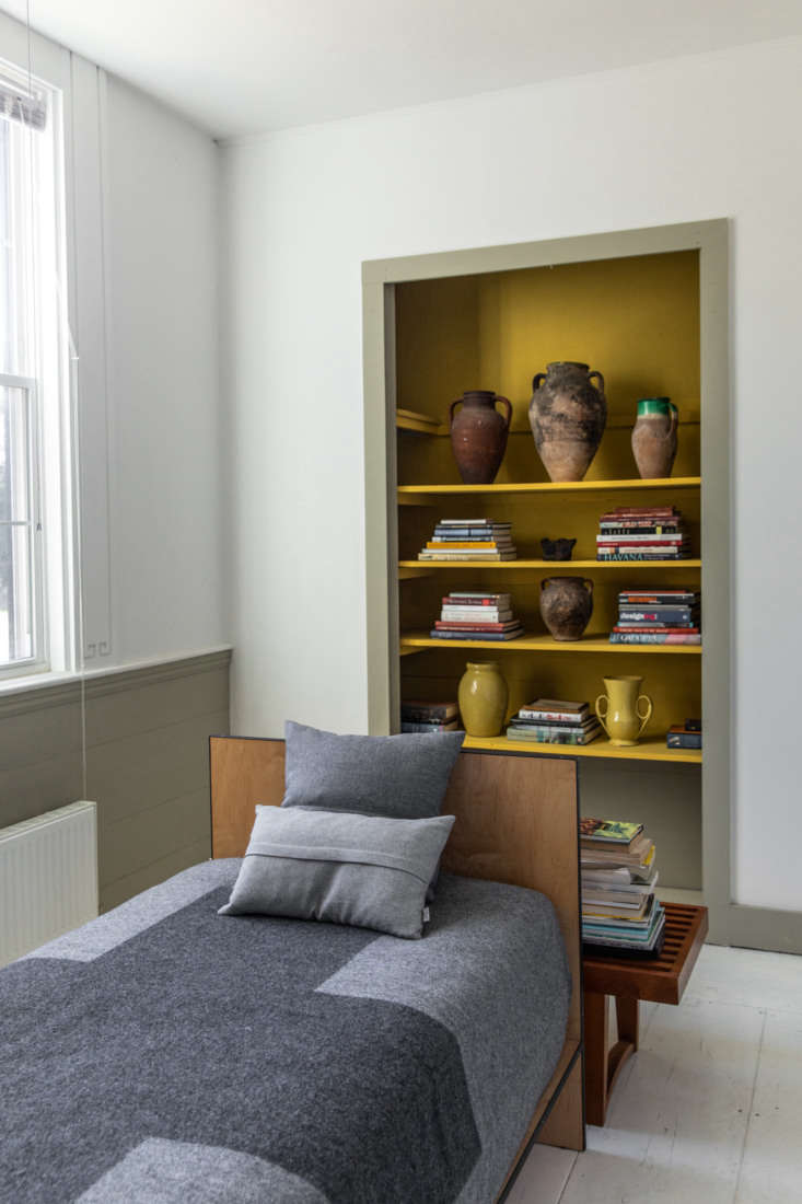 A wood daybed in a church-turned-home inspired by a visit to Marfa.