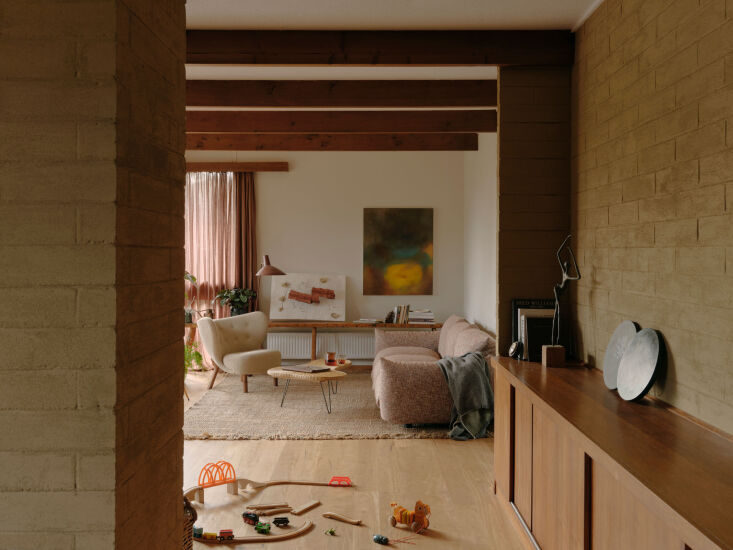 Modernist living room featuring an Arflex Marenco sofa and a Little Petra armchair.