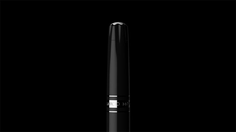 A black fountain pen with silver accents positioned vertically against a black background.