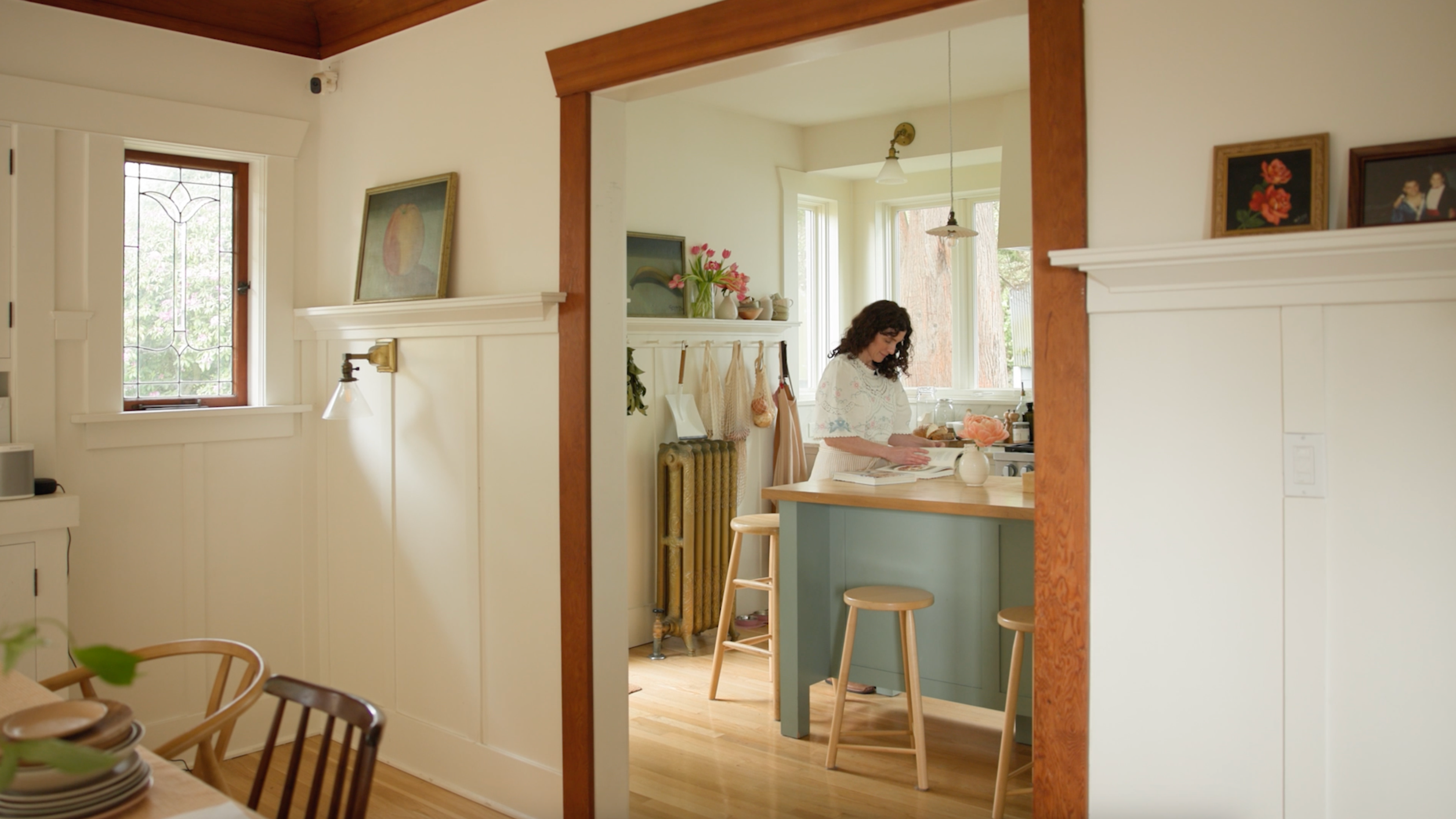 Modernized kitchen in a historic home featuring custom cabinetry and integrated appliances.