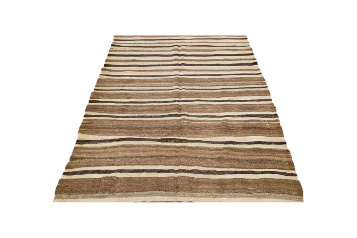 A brown vintage Kilim handmade flatweave rug with intricate patterns.