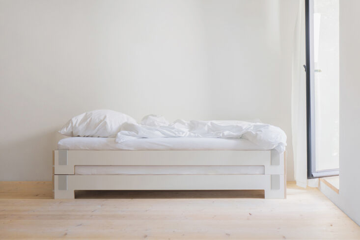 Nils Holger Moormann's Tagedieb stackable bed showing its distinct birch plywood construction.