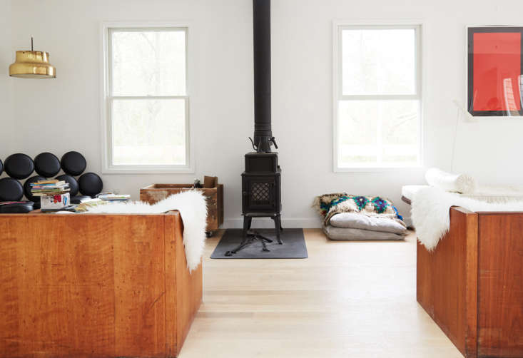 Two minimalist daybeds sourced from an auction in an artist's family home.
