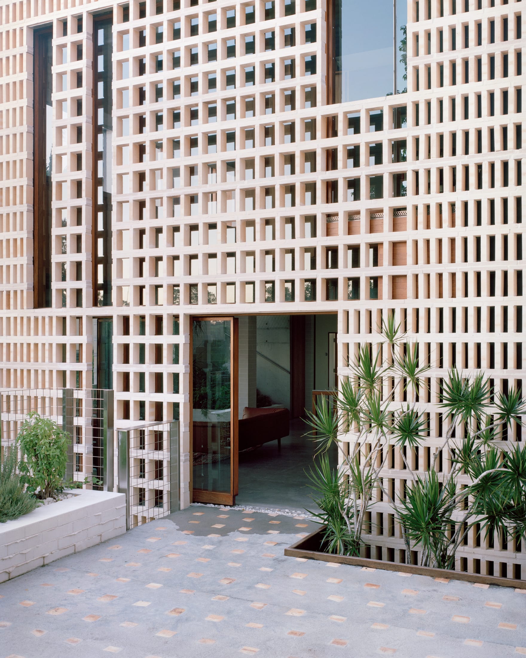 Interior view of the Birdwood House featuring recycled hardwood ceilings and natural lime-washed walls.