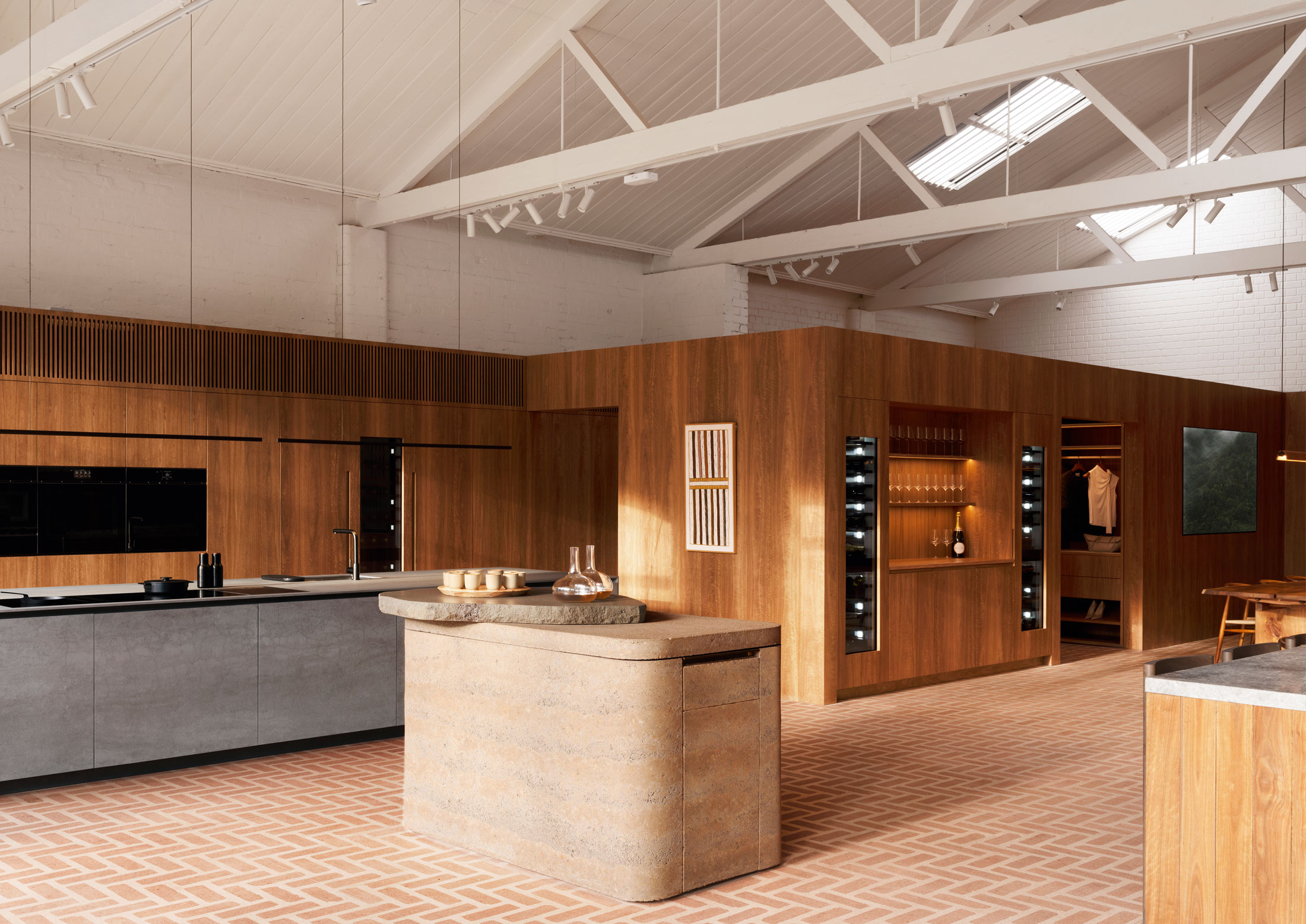 A minimalist kitchen display with integrated refrigeration and a seamless, clutter-free aesthetic.