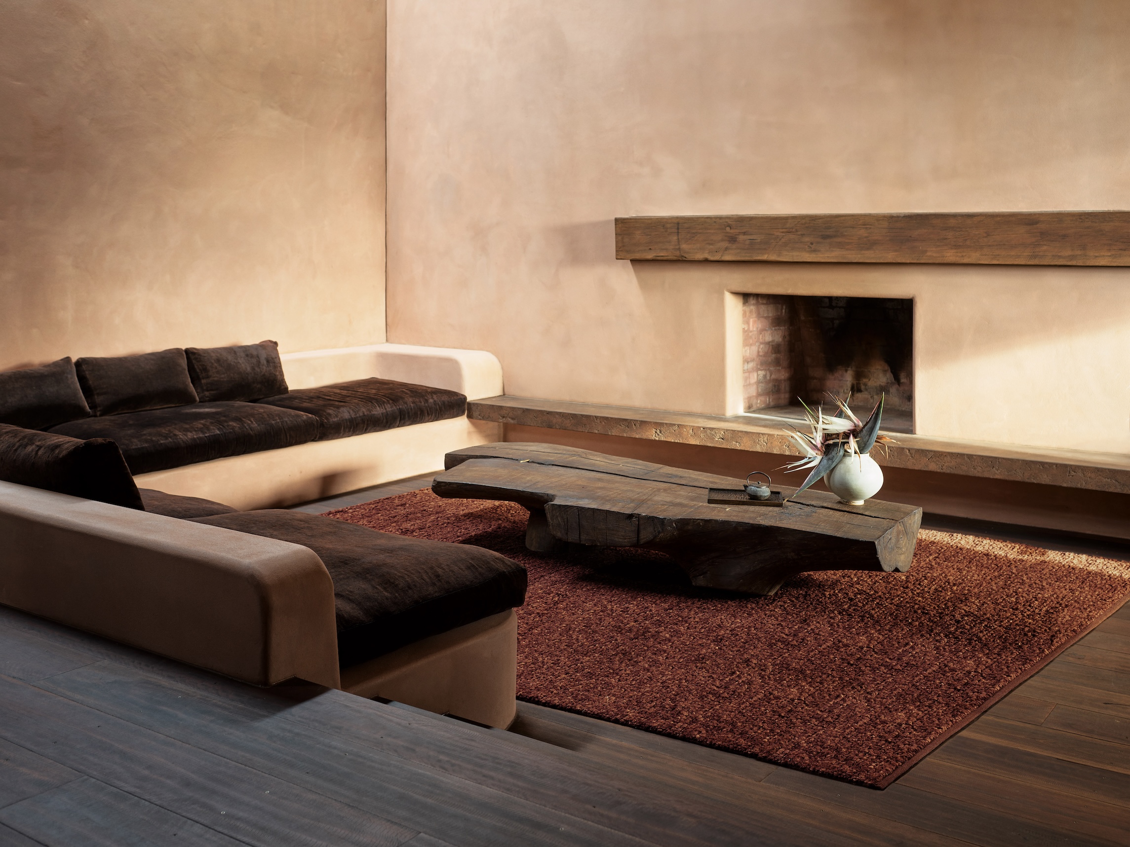 Sunken living room with Darwin stringy bark flooring and exposed ceiling beams.