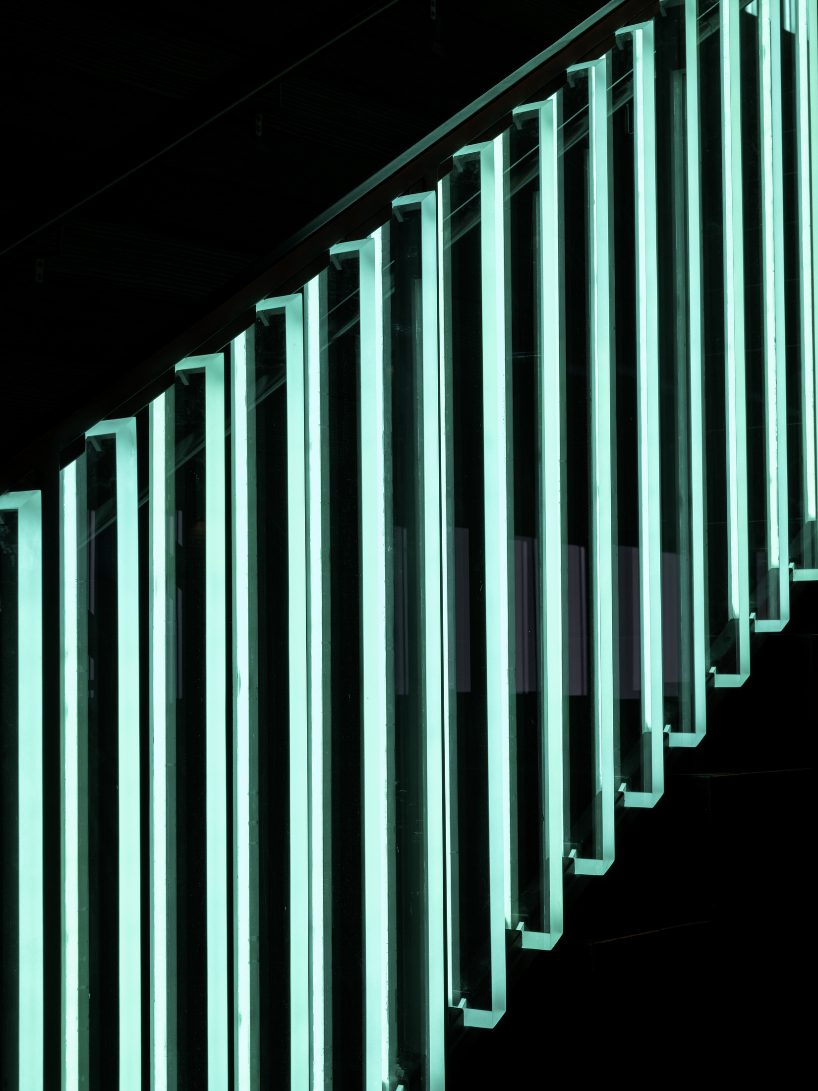 Detail of crimson rope art installation by Fibrous Co in a dining booth.