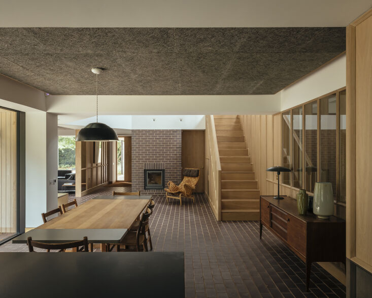 Dining room with a Børge Mogensen table, Hans Wegner chairs, and an Arne Jacobsen pendant light.
