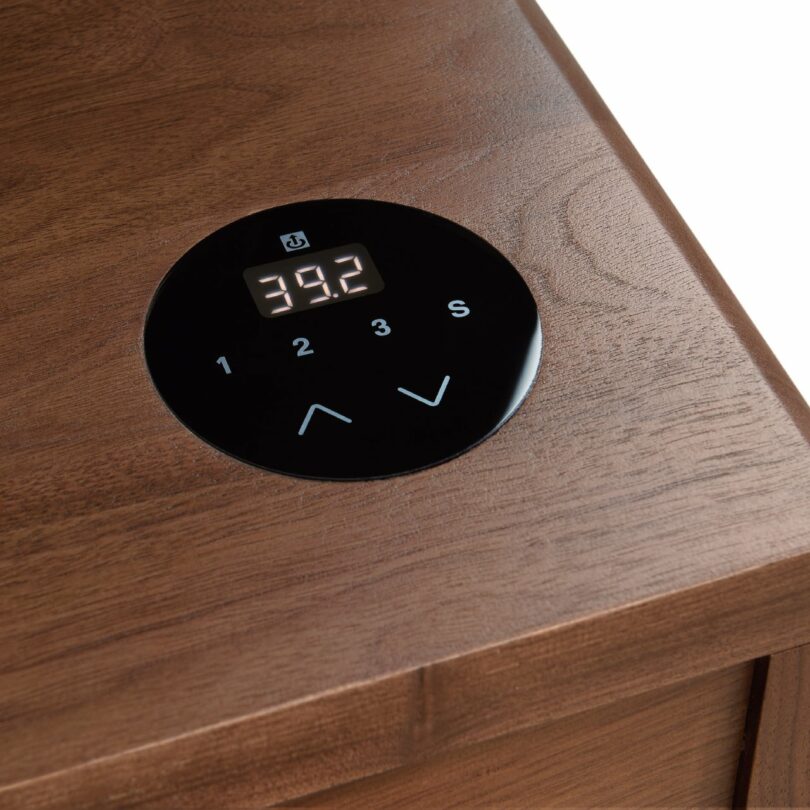 Close-up of the digital control panel on the wooden surface of the Lincoln desk showing a height of 39.2 inches.