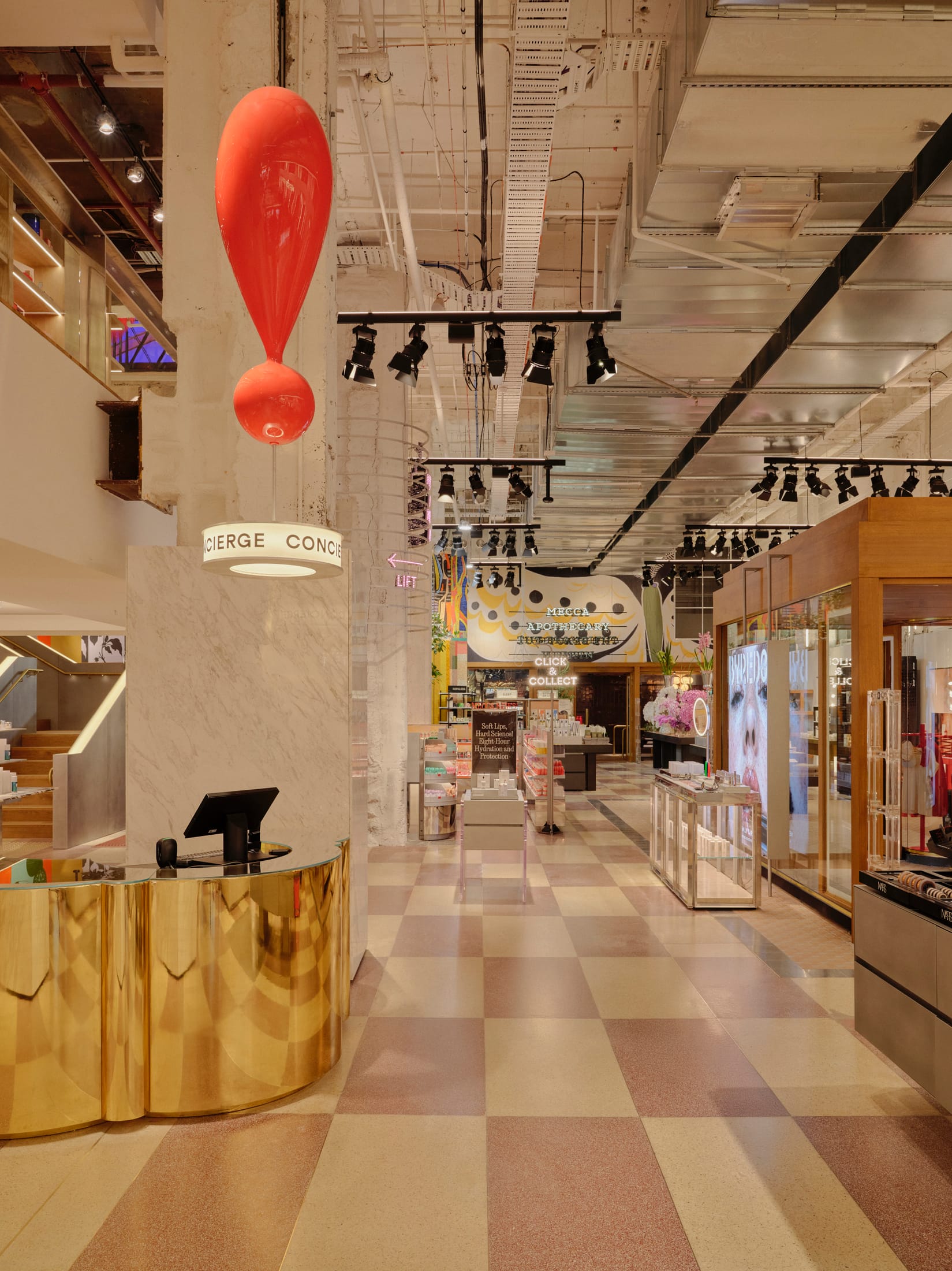 An elegantly furnished seating area within the store featuring contemporary art and plush furniture.